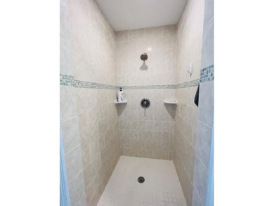 2 bedroom, 2.5 baths, overlooking golf course, tile floors on  in Florida - for sale on GolfHomes.com, golf home, golf lot