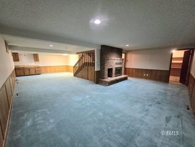This large, contemporary family residence boasts five bedrooms on Miles City Town and Country Club in Montana - for sale on GolfHomes.com, golf home, golf lot