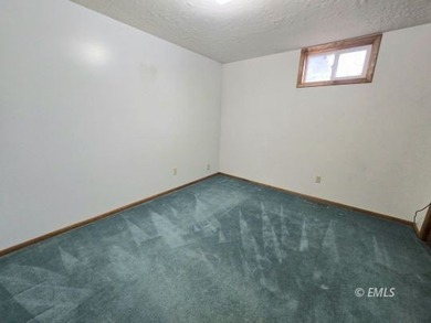 This large, contemporary family residence boasts five bedrooms on Miles City Town and Country Club in Montana - for sale on GolfHomes.com, golf home, golf lot