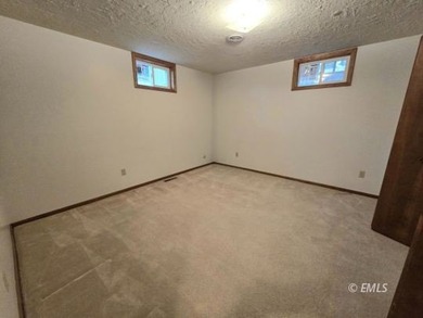 This large, contemporary family residence boasts five bedrooms on Miles City Town and Country Club in Montana - for sale on GolfHomes.com, golf home, golf lot