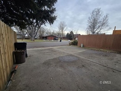 This large, contemporary family residence boasts five bedrooms on Miles City Town and Country Club in Montana - for sale on GolfHomes.com, golf home, golf lot