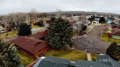 This large, contemporary family residence boasts five bedrooms on Miles City Town and Country Club in Montana - for sale on GolfHomes.com, golf home, golf lot