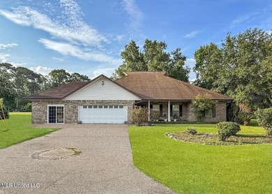 Experience timeless elegance and custom craftsmanship in this on Diamondhead Country Club in Mississippi - for sale on GolfHomes.com, golf home, golf lot