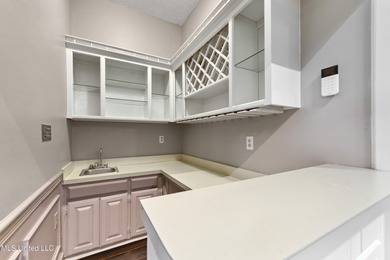 Experience timeless elegance and custom craftsmanship in this on Diamondhead Country Club in Mississippi - for sale on GolfHomes.com, golf home, golf lot