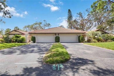 Tranquil, spotless, and effortlessly inviting, this on Palm Aire Country Club of Sarasota in Florida - for sale on GolfHomes.com, golf home, golf lot