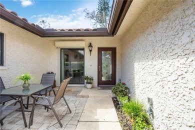 Tranquil, spotless, and effortlessly inviting, this on Palm Aire Country Club of Sarasota in Florida - for sale on GolfHomes.com, golf home, golf lot