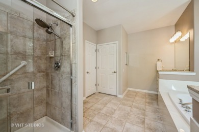 An INVITING front porch and PEACEFUL water feature greets you at on Whisper Creek Golf Club in Illinois - for sale on GolfHomes.com, golf home, golf lot