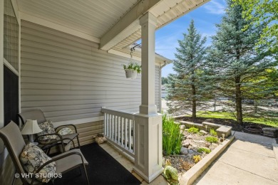 An INVITING front porch and PEACEFUL water feature greets you at on Whisper Creek Golf Club in Illinois - for sale on GolfHomes.com, golf home, golf lot