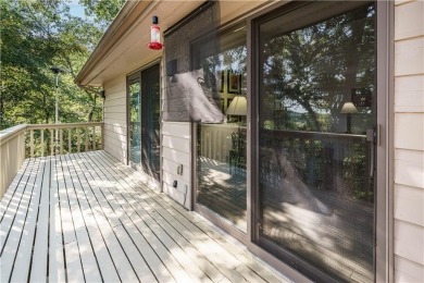 Located in a friendly, social neighborhood near the golf course on Holiday Island Golf Course in Arkansas - for sale on GolfHomes.com, golf home, golf lot