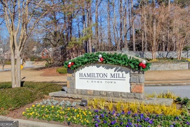 Welcome home to this inviting 4-bedroom, 2.5-bath beauty located on Hamilton Mill Golf Club in Georgia - for sale on GolfHomes.com, golf home, golf lot