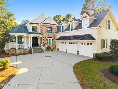 Nestled on a quiet tree-lined street, this custom-built home on Members Club At St. James Plantation in North Carolina - for sale on GolfHomes.com, golf home, golf lot