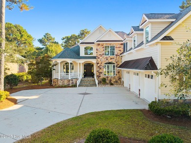 Nestled on a quiet tree-lined street, this custom-built home on Members Club At St. James Plantation in North Carolina - for sale on GolfHomes.com, golf home, golf lot