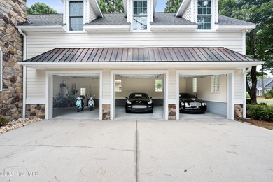 Nestled on a quiet tree-lined street, this custom-built home on Members Club At St. James Plantation in North Carolina - for sale on GolfHomes.com, golf home, golf lot