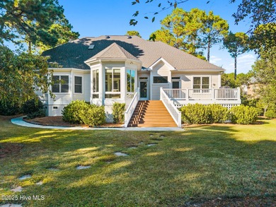 Nestled on a quiet tree-lined street, this custom-built home on Members Club At St. James Plantation in North Carolina - for sale on GolfHomes.com, golf home, golf lot
