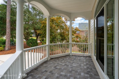 Nestled on a quiet tree-lined street, this custom-built home on Members Club At St. James Plantation in North Carolina - for sale on GolfHomes.com, golf home, golf lot