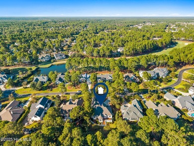 Nestled on a quiet tree-lined street, this custom-built home on Members Club At St. James Plantation in North Carolina - for sale on GolfHomes.com, golf home, golf lot