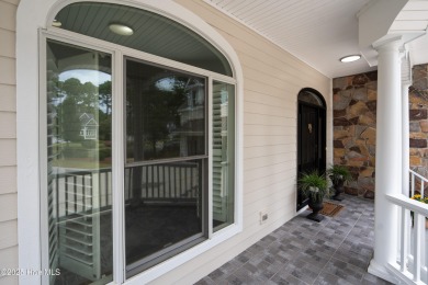 Nestled on a quiet tree-lined street, this custom-built home on Members Club At St. James Plantation in North Carolina - for sale on GolfHomes.com, golf home, golf lot
