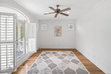 Nestled on a quiet tree-lined street, this custom-built home on Members Club At St. James Plantation in North Carolina - for sale on GolfHomes.com, golf home, golf lot