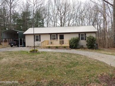 Well-maintained property featuring a 14' RV carport with hookups on Lake Tansi Village Country Club in Tennessee - for sale on GolfHomes.com, golf home, golf lot