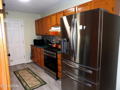 Well-maintained property featuring a 14' RV carport with hookups on Lake Tansi Village Country Club in Tennessee - for sale on GolfHomes.com, golf home, golf lot