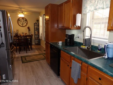 Well-maintained property featuring a 14' RV carport with hookups on Lake Tansi Village Country Club in Tennessee - for sale on GolfHomes.com, golf home, golf lot