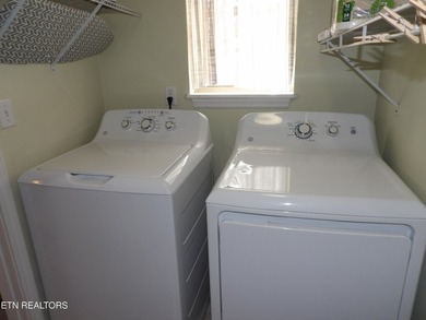 Well-maintained property featuring a 14' RV carport with hookups on Lake Tansi Village Country Club in Tennessee - for sale on GolfHomes.com, golf home, golf lot