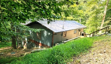 Beautifully updated 3 bed/3 bath cabin in Hide-A-Way Hills on Hide-A-Way Hills Golf Club in Ohio - for sale on GolfHomes.com, golf home, golf lot