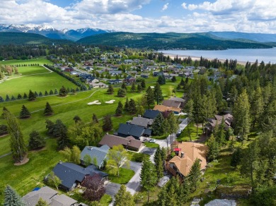 If you want beautiful Swan Mountain views from almost every room on Eagle Bend Golf Course in Montana - for sale on GolfHomes.com, golf home, golf lot