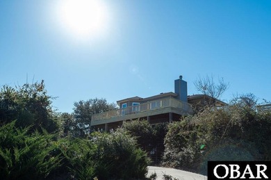 Sitting well elevated in an X flood zone, Sunny Days is located on The Currituck Golf Club in North Carolina - for sale on GolfHomes.com, golf home, golf lot