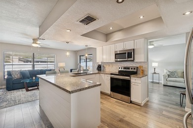 Welcome to this beautifully maintained 3-bedroom, 2-bath pool on Oak Hills Country Club in Florida - for sale on GolfHomes.com, golf home, golf lot