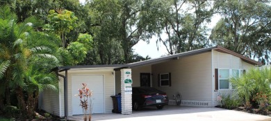 This spacious residence of 2 bedroom features oasis landscaping on Schalamar Creek Golf and Country Club in Florida - for sale on GolfHomes.com, golf home, golf lot