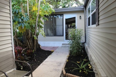 This spacious residence of 2 bedroom features oasis landscaping on Schalamar Creek Golf and Country Club in Florida - for sale on GolfHomes.com, golf home, golf lot