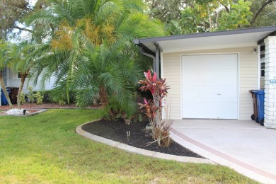 This spacious residence of 2 bedroom features oasis landscaping on Schalamar Creek Golf and Country Club in Florida - for sale on GolfHomes.com, golf home, golf lot