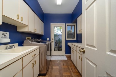 Truly remarkable home designed by Gary Kelly sits on almost 1/2 on Heritage Ridge Golf Club in Florida - for sale on GolfHomes.com, golf home, golf lot