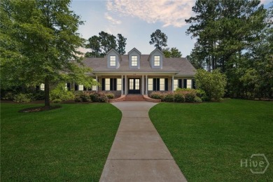 Step into timeless elegance in this beautifully crafted brick on Savannah Quarters Country Club in Georgia - for sale on GolfHomes.com, golf home, golf lot