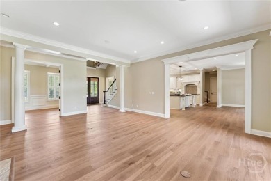 Step into timeless elegance in this beautifully crafted brick on Savannah Quarters Country Club in Georgia - for sale on GolfHomes.com, golf home, golf lot