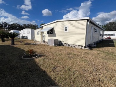 This charming 1,284-square-foot home, located in the flourishing on Palm Hill Golf Club in Florida - for sale on GolfHomes.com, golf home, golf lot