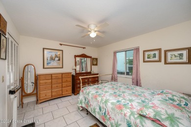 Located in a military, country club community, this charming on Indian River Colony Club in Florida - for sale on GolfHomes.com, golf home, golf lot