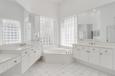 This single-story, three-bedroom / three-bathroom home offers a on PGA National Golf Club in Florida - for sale on GolfHomes.com, golf home, golf lot
