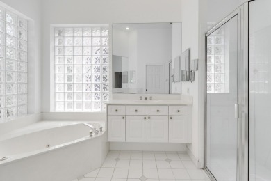 This single-story, three-bedroom / three-bathroom home offers a on PGA National Golf Club in Florida - for sale on GolfHomes.com, golf home, golf lot