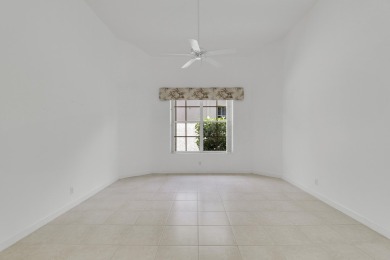 This single-story, three-bedroom / three-bathroom home offers a on PGA National Golf Club in Florida - for sale on GolfHomes.com, golf home, golf lot