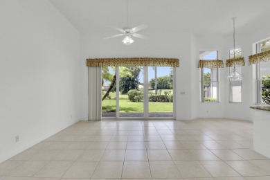 This single-story, three-bedroom / three-bathroom home offers a on PGA National Golf Club in Florida - for sale on GolfHomes.com, golf home, golf lot