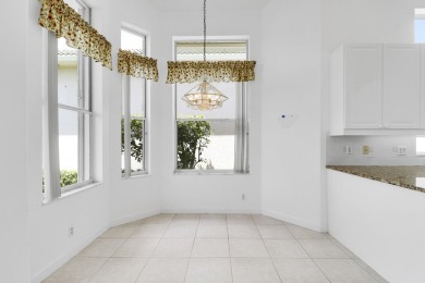 This single-story, three-bedroom / three-bathroom home offers a on PGA National Golf Club in Florida - for sale on GolfHomes.com, golf home, golf lot