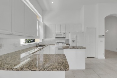This single-story, three-bedroom / three-bathroom home offers a on PGA National Golf Club in Florida - for sale on GolfHomes.com, golf home, golf lot