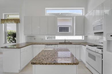 This single-story, three-bedroom / three-bathroom home offers a on PGA National Golf Club in Florida - for sale on GolfHomes.com, golf home, golf lot