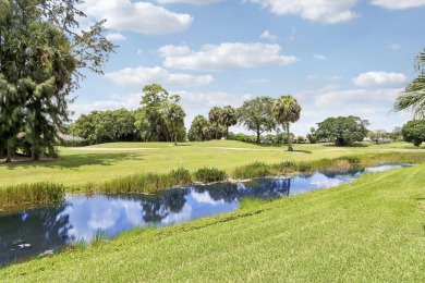 This single-story, three-bedroom / three-bathroom home offers a on PGA National Golf Club in Florida - for sale on GolfHomes.com, golf home, golf lot