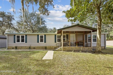 This is the perfect opportunity to live just across a peaceful on  in Florida - for sale on GolfHomes.com, golf home, golf lot