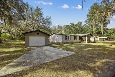 This is the perfect opportunity to live just across a peaceful on  in Florida - for sale on GolfHomes.com, golf home, golf lot