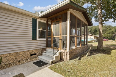 This is the perfect opportunity to live just across a peaceful on  in Florida - for sale on GolfHomes.com, golf home, golf lot