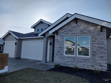 This incredible home features a beautiful kitchen with quartz on Hunters Point Golf Club in Idaho - for sale on GolfHomes.com, golf home, golf lot